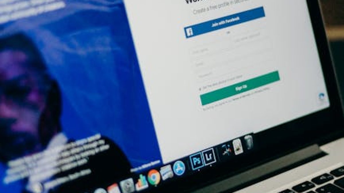 Close-up view of a laptop displaying a sign-up page for an online platform.